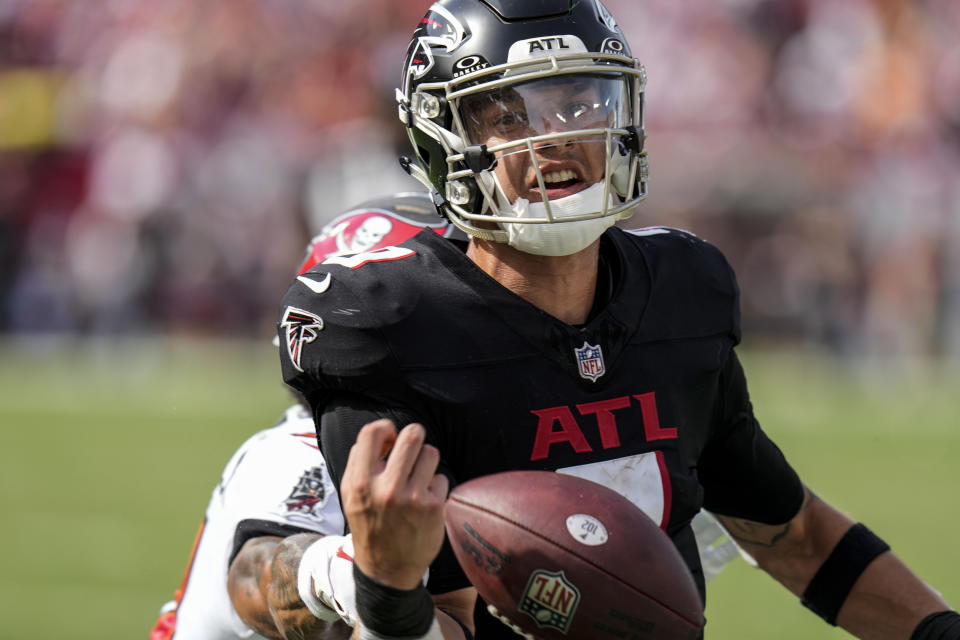 Atlanta Falcons quarterback Desmond Ridder (9) fumbles against Tampa Bay Buccaneers safety Antoine Winfield Jr. (31) during the second half of an NFL football game, Sunday, Oct. 22, 2023, in Tampa, Fla. (AP Photo/Chris O'Meara)