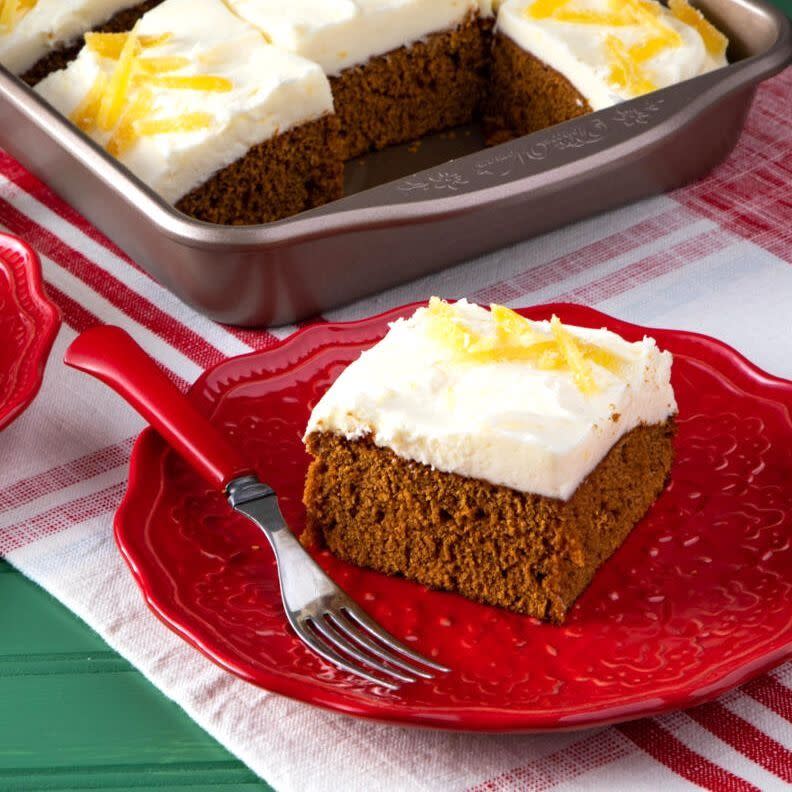 gingerbread cake with frosting on red plate