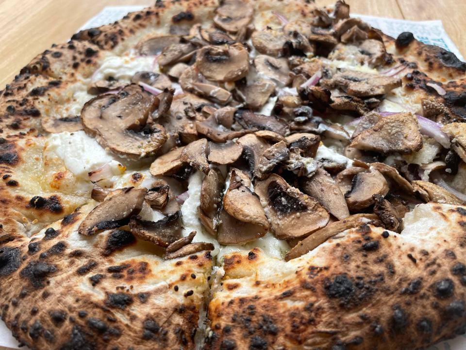 The mushroom white pizza from AVA at Kern's Food Hall is made with ricotta and mozzarella cheeses, caramelized onions, shoyu and mushroom.