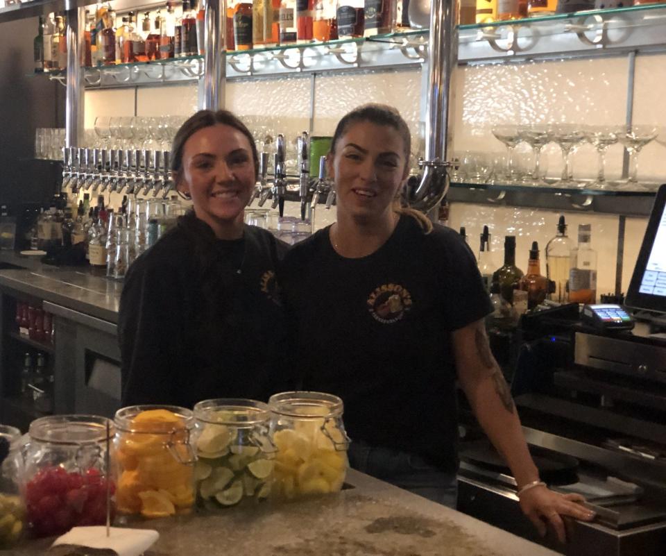 Employees Kate Gerry, left, and Kristine Erickson are seen here behind the bar counter at Alisson's Restaurant in Kennebunkport, Maine, on Wednesday, Oct. 18, 2023.