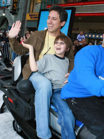 <p>E. Charbonneau/WireImage</p> Ray Romano and his son Joseph Raymond during The Hollywood World Premiere of 20th Century Fox's 'Ice Age: The Meltdown'