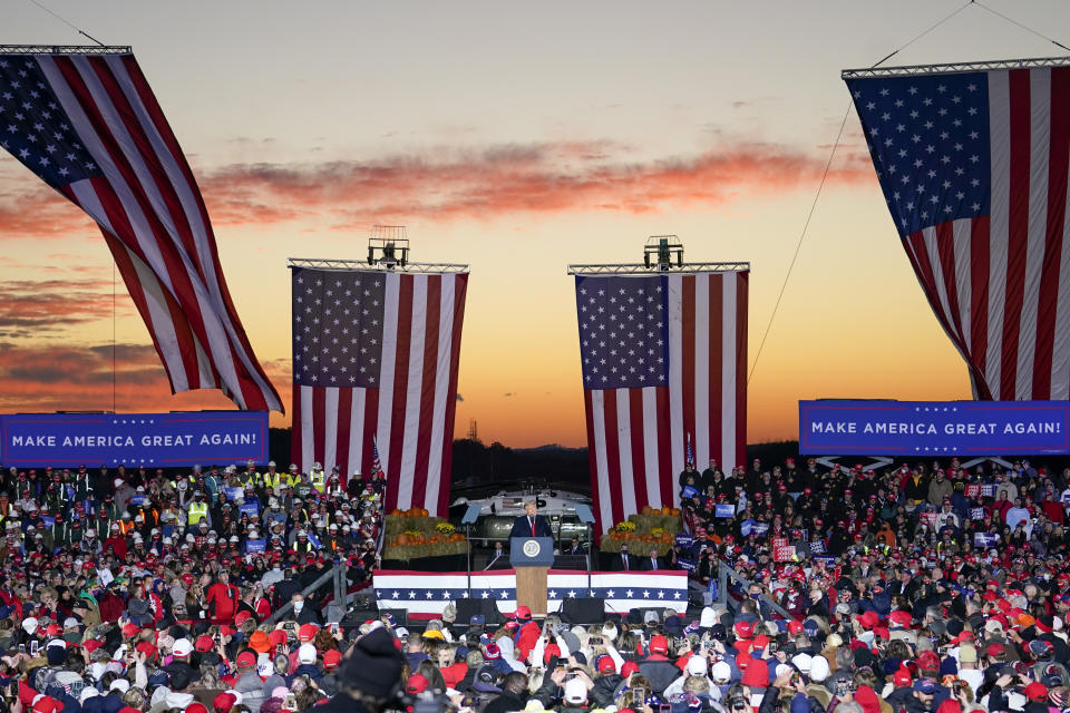 President Donald Trump addresses the crowd as the sun sets during a campaign stop, Saturday, Oct. 31, 2020, at the Butler County Regional Airport in Butler, Pa. (AP Photo/Keith Srakocic)