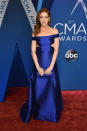 <p>Snow stunned in a satin royal blue gown and matching clutch. (Photo: Getty Images) </p>