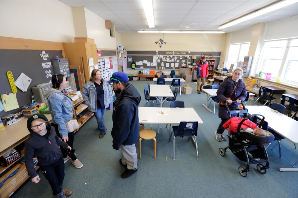 People check out a classroom during an open house event at Roosevelt Elementary School in Neenah.