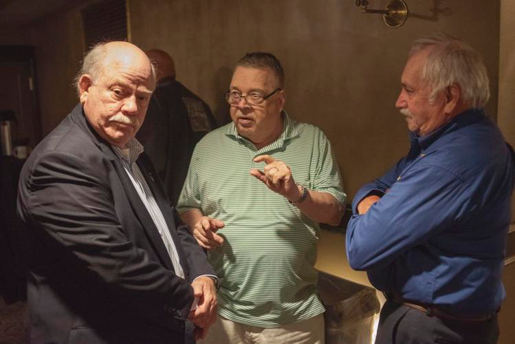 Laconia City Councilors, from left, Steven Bogert (Ward 5), Bob Soucy (Ward 2), and Mark Haynes (Ward 4) speak before a Thursday press conference for the 101st Laconia Motorcycle Week at the Colonial Theatre in Laconia. All six councilors and Mayor Andrew Hosmer attended the press conference.