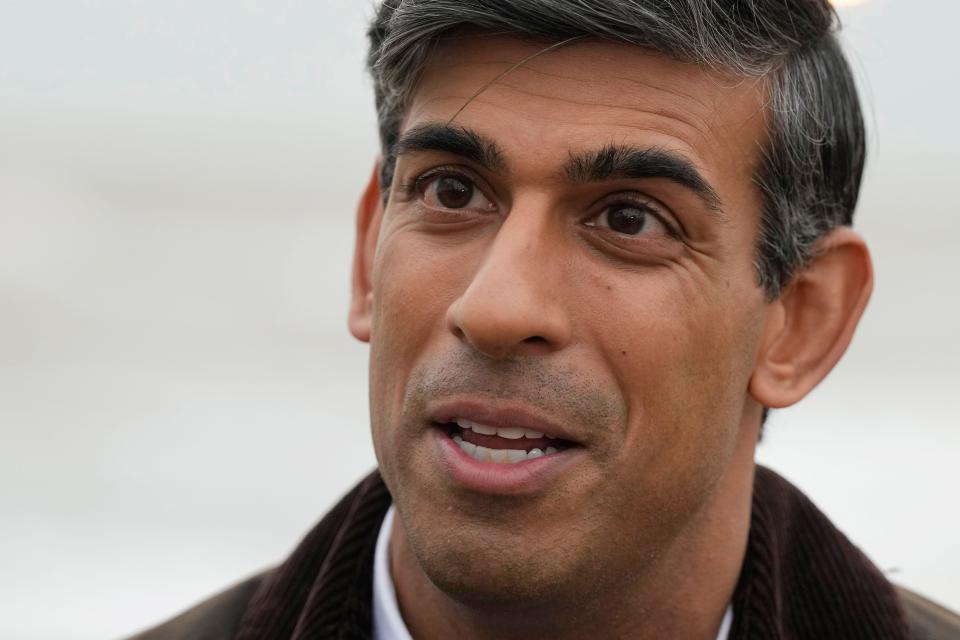 British Prime Minister Rishi Sunak speaks to a TV reporter during his visit to Clacton-on-Sea, England, Wednesday, Oct. 18, 2023. (AP Photo/Frank Augstein, Pool)