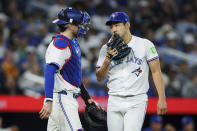 Toronto Blue Jays catcher Danny Jansen (9) and pitcher Yusei Kikuchi (16) meet on the mound during the fourth inning of the team's baseball game against the Minnesota Twins on Friday, May 10, 2024, in Toronto. (Cole Burtson/The Canadian Press via AP)
