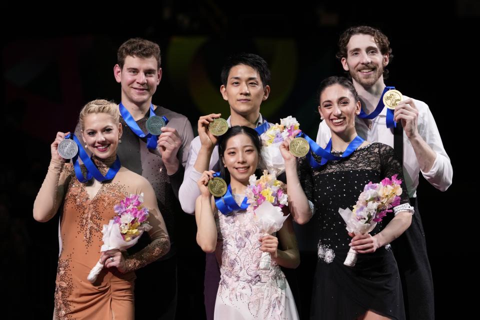 Riku Miura and Ryuichi Kihara of Japan, center, with gold medals, Alexa Knierim and Brandon Frazier of the U.S., left, with silver medals, and Sara Conti and Niccolo Macii of Italy, with bronze medals, pose for a photo during the award ceremony for the pairs' free skating program in the World Figure Skating Championships in Saitama, north of Tokyo, Thursday, March 23, 2023. (AP Photo/Hiro Komae)