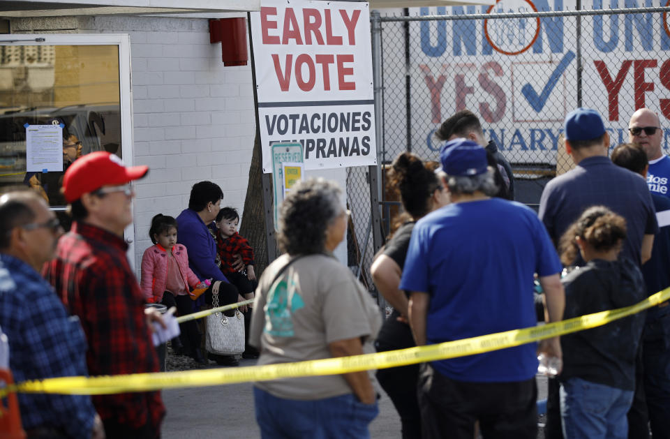 People wait in line to vote early at the Culinary Workers union Monday, Feb. 17, 2020, in Las Vegas. (AP Photo/John Locher)