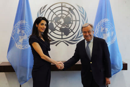 International human rights lawyer Amal Clooney shakes hands with United Nations Secretary General, Antonio Guterres, at U.N. headquarters in New York, U.S., March 10, 2017. REUTERS/Lucas Jackson