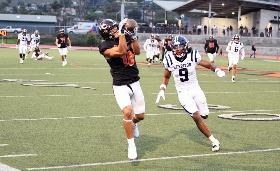 Ventura College receiver Eli Aragon reels in one of his nine receptions Saturday night against visiting Cerritos College at the VC Sportsplex. The Pirates fell 35-31.