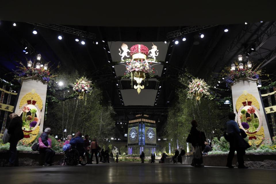 People attend a preview for the annual Philadelphia Flower Show at the Pennsylvania Convention Center in Friday, March 1, 2013, in Philadelphia. More than 270,000 people are expected to converge on the Pennsylvania Convention Center for the event, which runs through March 10. Billed as the world's largest indoor flower show, it's also one of the oldest, dating back to 1829. (AP Photo/Matt Rourke)