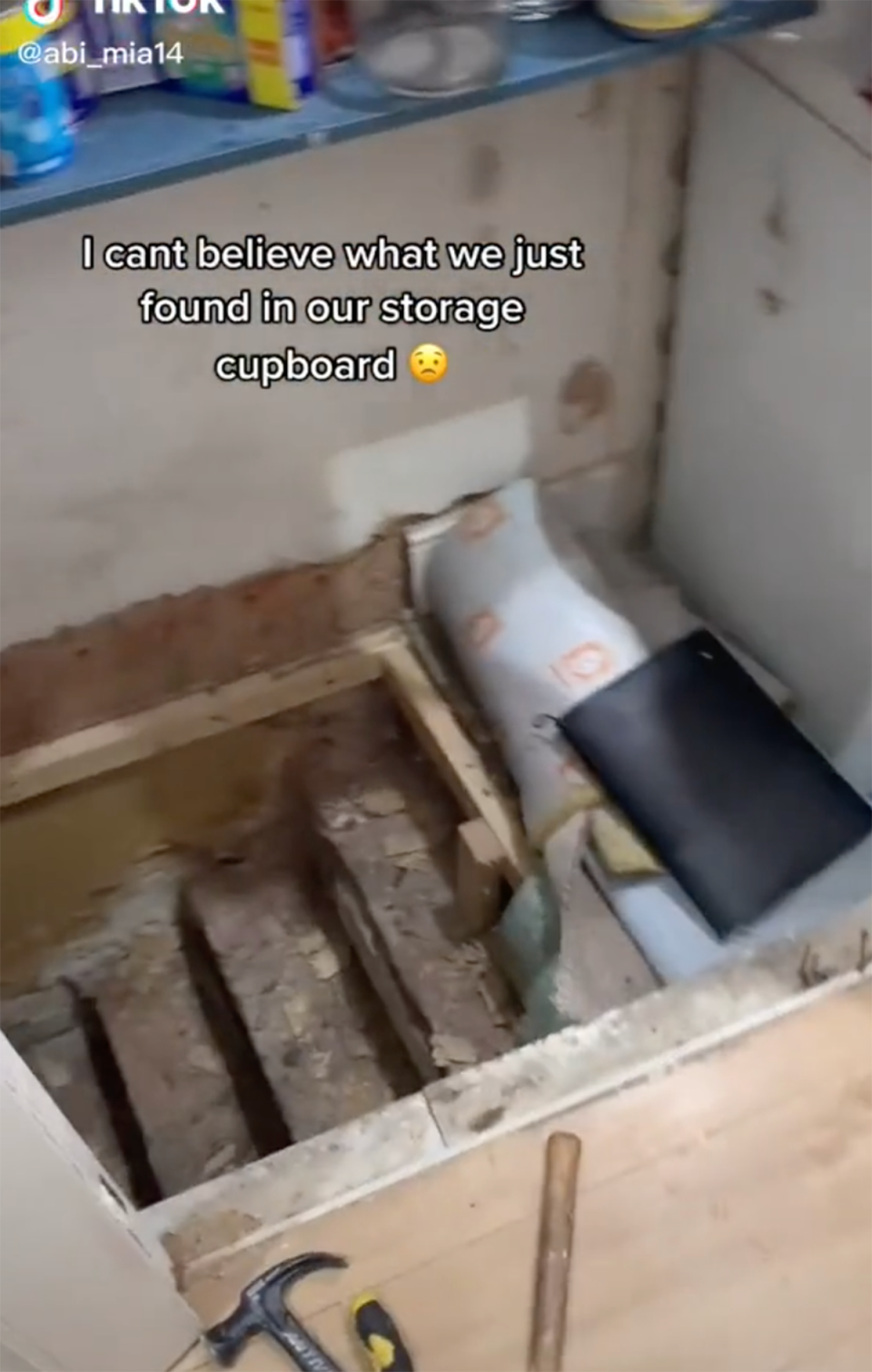 Screenshot from TikTok shows opened floor of storage cupboard.