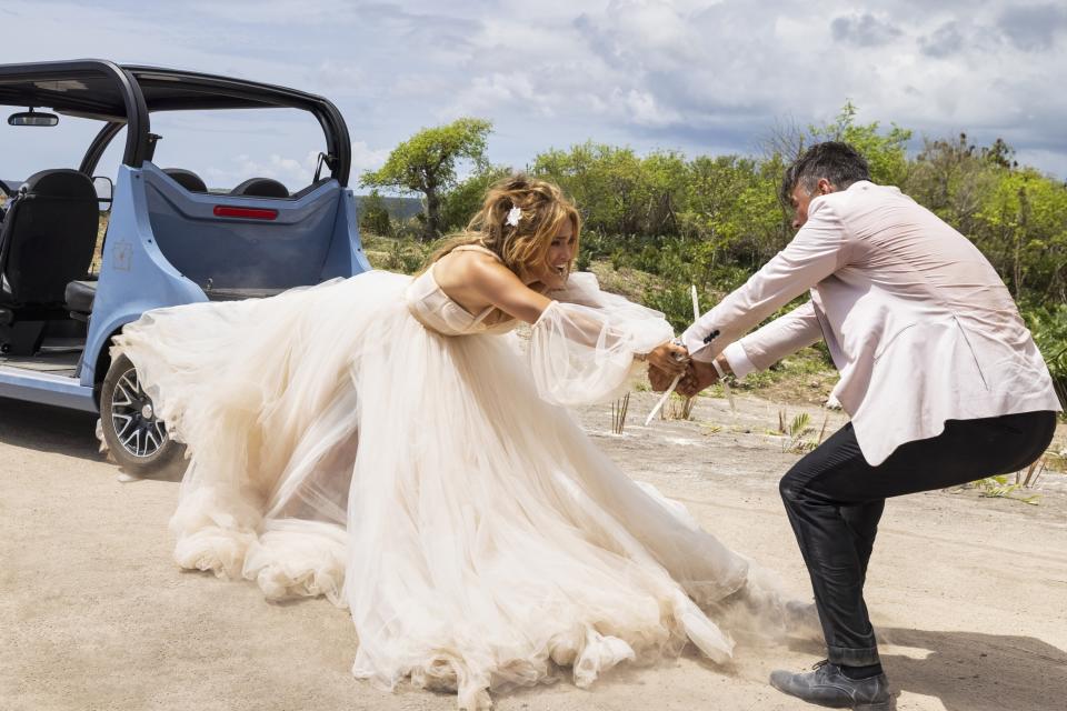 The scene from the film shows J.Lo's dress caught in the back wheel of the car as it tumbles off a cliff and Josh pulls her back to safety