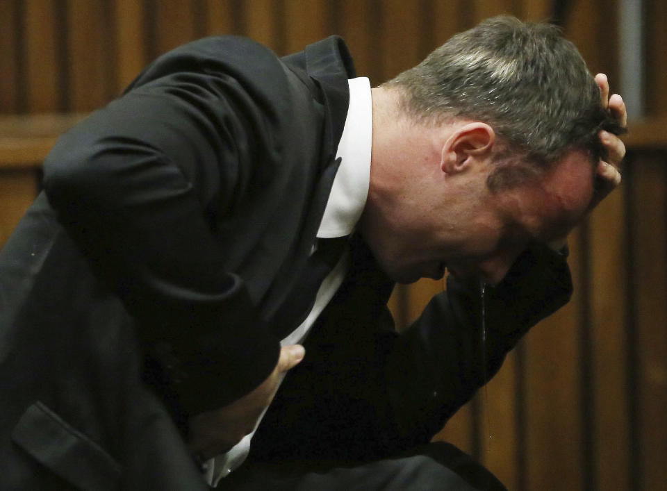 FILE - Oscar Pistorius weeps as he listens to evidence by a pathologist in court in Pretoria, South Africa April 7 2014. Pistorius shot his girlfriend Reeva Steenkamp more than a decade ago in a Valentine's Day killing that jolted the world and shattered the image of a sports superstar. (AP Photo/Themba Hadebe, Pool, File)