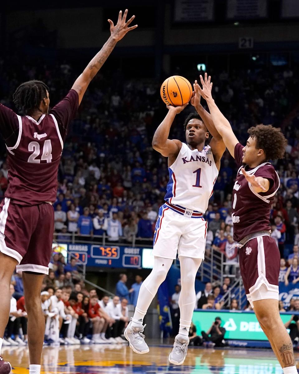 Kansas guard Joseph Yesufu (1) shoots under pressure from Texas Southern forward John Walker III (24) and guard Isaiah Martin (0) during the first half of a game Monday in Lawrence.