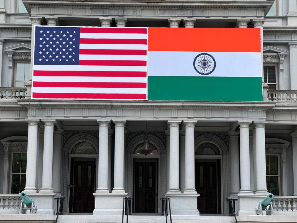 Flags of India and US adorn the Eisenhower Executive Office Building of the White House in Washington, DC on 20 June (AFP via Getty Images)