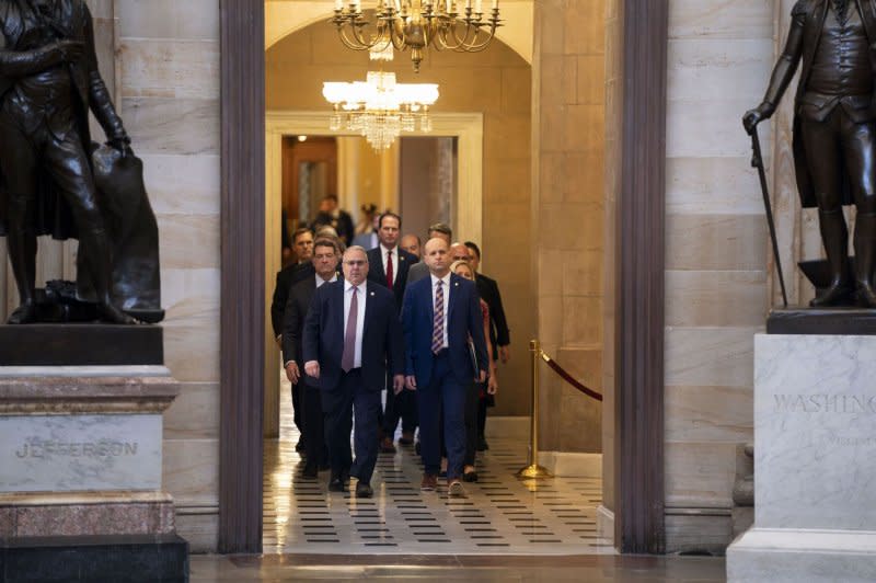 Sergeant at Arms of the House of Representatives William McFarland (L) and Acting Clerk of the House Kevin McCumber lead 11 House Republican impeachment managers as they deliver the Articles of Impeachment against Homeland Security Secretary Alejandro Mayorkas to the Senate through the U.S. Capitol Rotunda in Washington, D.C., on Tuesday. Photo by Bonnie Cash/UPI