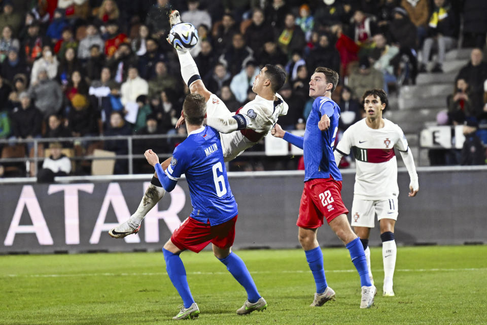 Portugal's Cristiano Ronaldo, second from left, in action during the UEFA Euro 2024 group J qualifying soccer match between Liechtenstein and Portugal, in Vaduz, Liechtenstein, Thursday, Nov. 16, 2023. (Gian Ehrenzeller/Keystone via AP)