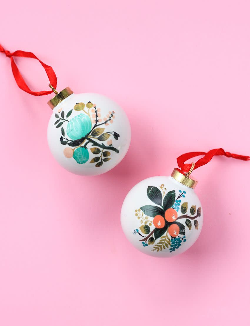 <p>Raise your hand if you have zero skills with a paintbrush. This is the holiday craft for you, then, since all you need to do is stick a temporary tattoo onto an ornament. See how it's done at <a href="https://thecraftedlife.com/temporary-tattoo-ornaments/" rel="nofollow noopener" target="_blank" data-ylk="slk:The Crafted Life;elm:context_link;itc:0;sec:content-canvas" class="link ">The Crafted Life</a>.</p>