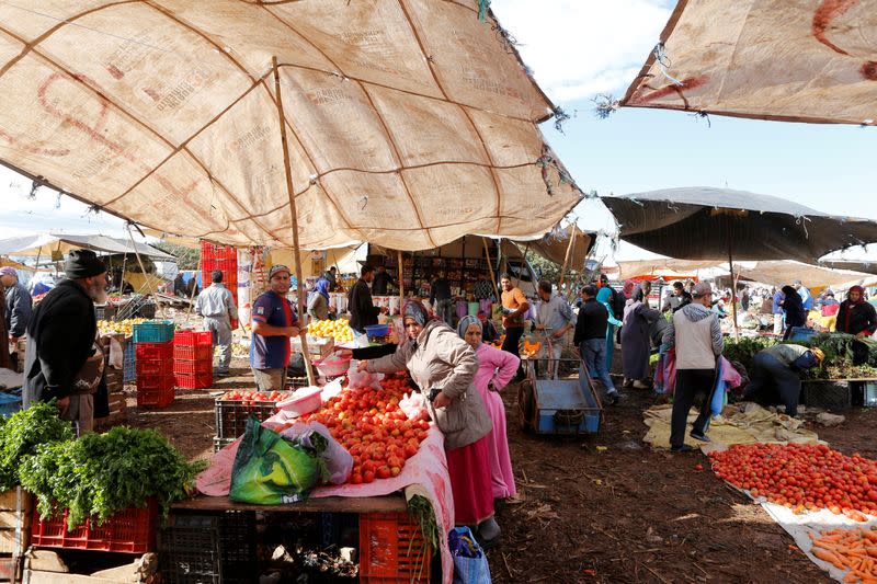 FILE PHOTO: People shop at a vegetable market on the outskirts of Casablanca