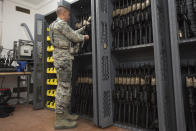 In this Oct. 26, 2018, photo made available by the U.S. Air Force, a 7th Reconnaissance Squadron security forces patrolman checks weapons at Naval Air Station Sigonella, Italy. In the first public accounting of its kind in decades, an Associated Press investigation has found that at least 1,900 US military firearms were lost or stolen during the 2010s, with some resurfacing in violent crimes. Because some armed services have suppressed the release of basic information, AP’s total is a certain undercount. (Staff Sgt. Ramon A. Adelan/U.S. Air Force via AP)