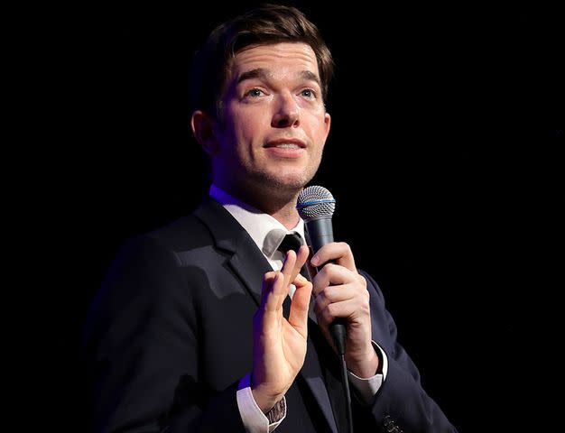 <p>Dimitrios Kambouris/Getty</p> John Mulaney performs stand-up from his "From Scratch" Tour on September 01, 2021 in New York City.