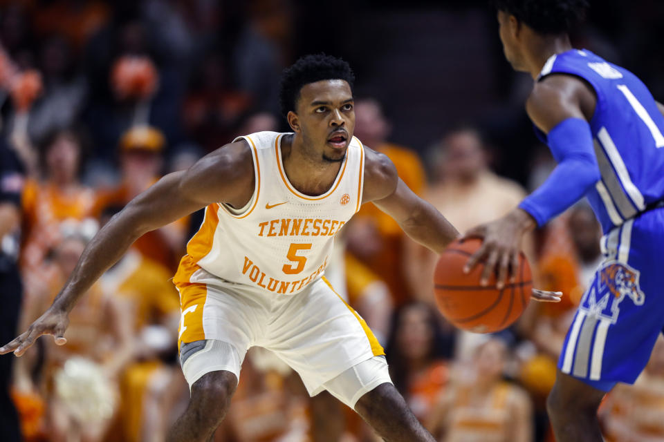 Tennessee guard Josiah-Jordan James (5) defends against Memphis guard Tyler Harris (1) during the first half of an NCAA college basketball game Saturday, Dec. 14, 2019, in Knoxville, Tenn. (AP Photo/Wade Payne)