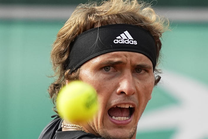 Germany's Alexander Zverev eyes the ball as he plays as shot against Austria's Sebastian Ofner during their first round match at the French Open tennis tournament in Roland Garros stadium in Paris, France, Sunday, May 22, 2022. (AP Photo/Michel Euler)