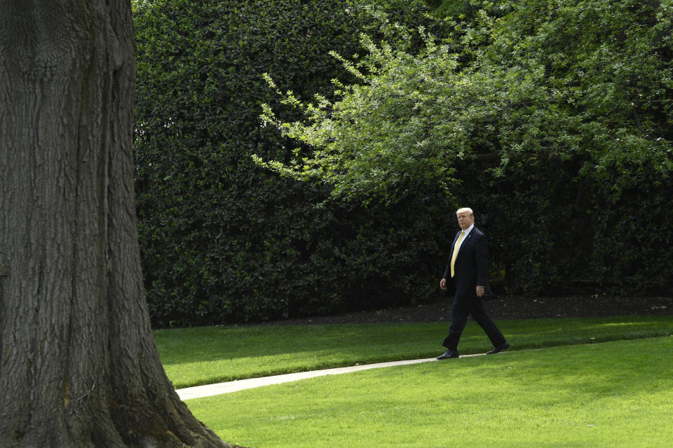 President Donald Trump walks out of the Oval Office as goes to speak on the South Lawn of the White House in Washington, Thursday, April 25, 2019, as part of the activities for Take Our Daughters and Sons to Work Day at the White House. (AP Photo/Susan Walsh)