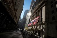 The U.S. flag is raised on the front facade of the NYSE in New York