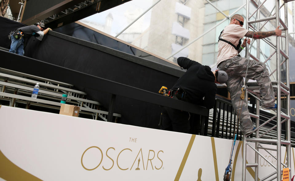 Workers setup the bleachers on the red carpet as preparations are made for the 86th Academy Awards in Los Angeles, Wednesday, Feb. 26, 2014. The Academy Awards will be held at the Dolby Theatre on Sunday, March 2. (Photo by Matt Sayles/Invision/AP)