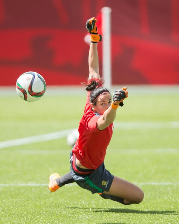 Australia's goalkeeper Lydia Williams dives for the ball during the team's training session at Commonwealth Stadium in Edmonton, Alberta on June 26, 2015