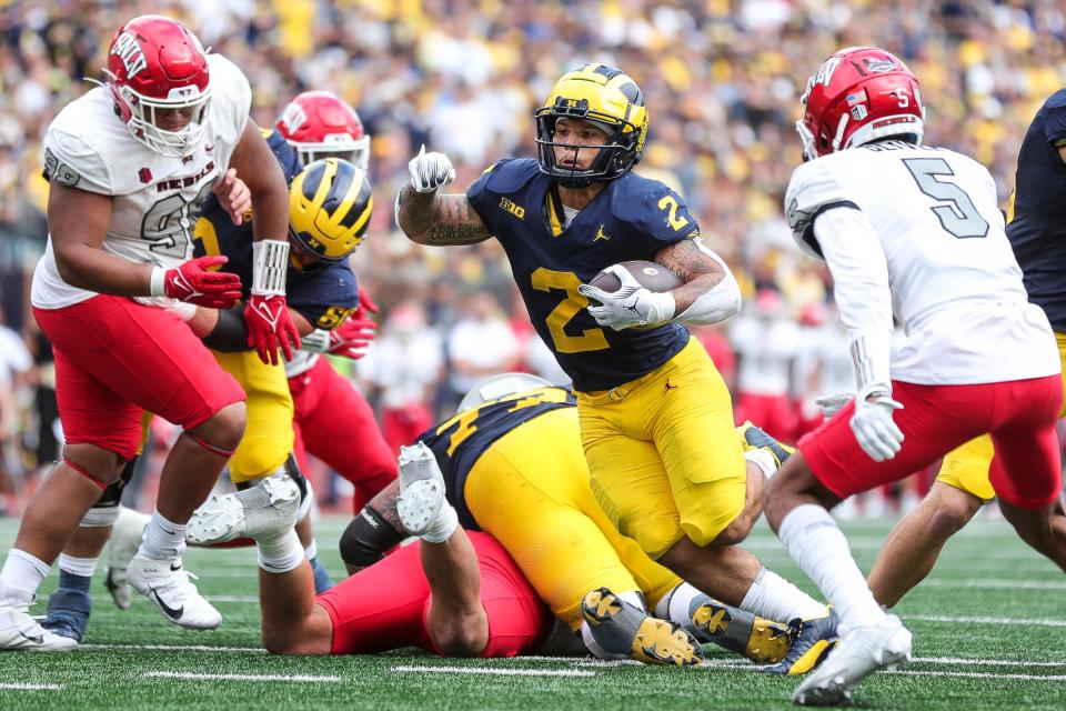 Michigan running back Blake Corum (2) runs for a touchdown against UNLV during the second half at Michigan Stadium in Ann Arbor on Saturday, Sept. 9, 2023.