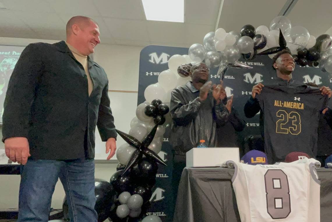 Arlington Martin coach Bob Wager gives Javien Toviano his all-american jersey.