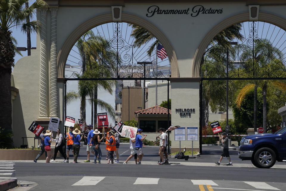 Picketers gather outside Paramount Pictures during a Writers Guild rally on Thursday, July 13, 2023, in Los Angeles. The rally follows a press conference announcing a strike by The Screen Actors Guild-American Federation of Television and Radio Artists. This marks the first time since 1960 that actors and writers will picket film and television productions at the same time. (AP Photo/Mark J. Terrill)