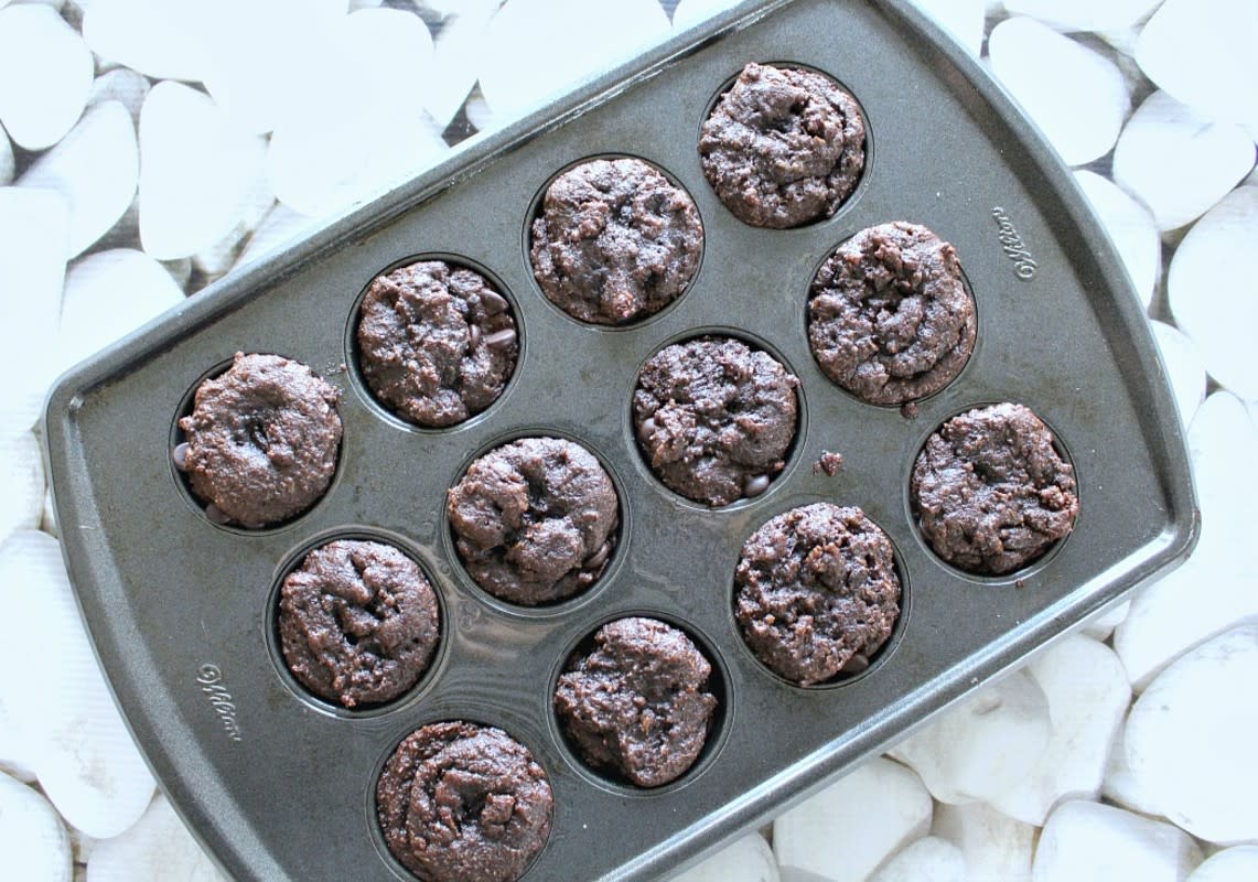 <p>Little fudgy gems. Bake two batches of these. They disappear quickly. Get the recipe <a href="http://skinnysweetsdaily.com/mini-paleo-chocolate-chip-brownie-cupcakes/" rel="nofollow noopener" target="_blank" data-ylk="slk:HERE;elm:context_link;itc:0;sec:content-canvas" class="link rapid-noclick-resp">HERE</a>. </p>