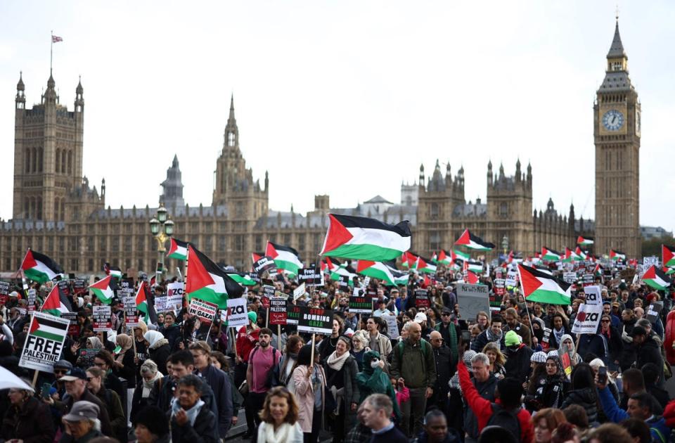 Protesters on Westminster Bridge as thousands in cities around the world took to streets to oppose the war (AFP via Getty Images)