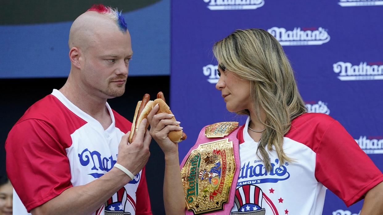 <div>(L-R Nick Wehry and Miki Sudo do a stare-down during a weigh-in for the 2024 Nathan's Famous Fourth of July International Hot Dog-Eating Championship at Hudson Yards in New York City on July 3, 2024. The contest will take place in Coney Island, New York on July 4, 2024. (Photo by TIMOTHY A. CLARY / AFP) (Photo by TIMOTHY A. CLARY/AFP via Getty Images)</div>