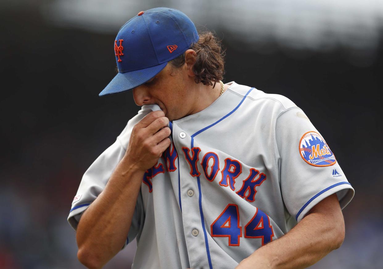 Jun 21, 2019; Chicago, IL, USA; New York Mets starting pitcher Jason Vargas (44) reacts as he leaves the game against the Chicago Cubs during the fifth inning at Wrigley Field. Mandatory Credit: Jim Young-USA TODAY Sports