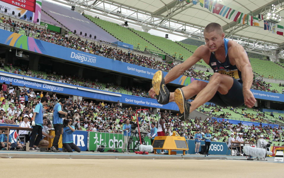 FILE - USA's Trey Hardee makes an attempt in the Decathlon Long Jump at the World Athletics Championships in Daegu, South Korea, Saturday, Aug. 27, 2011. (AP Photo/Matt Dunham, File)