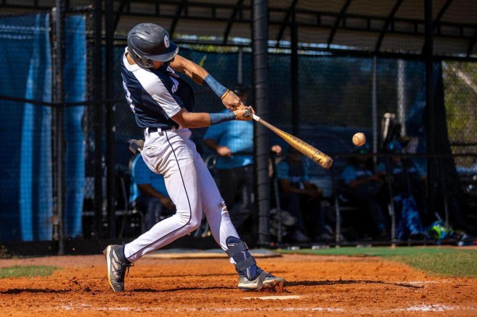Gulliver Prep junior Jacob Lombard swings at a pitch for a single during a high school baseball game against Somerset Academy Silver Palms at Gulliver Academy, in Coral Gables, Florida, on Tuesday, April 25, 2023.