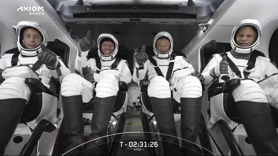 HOLD FOR STORY FILE - This photo provided by SpaceX shows the SpaceX crew seated in the Dragon spacecraft on Friday, April 8, 2022, in Cape Canaveral, Fla. Axiom handled the logistics for the trip. From left are Canadian private equity CEO Mark Pathy, American real estate tycoon Larry Connor; Michael Lopez-Alegria, an Axiom vice president who flew to space four times while a NASA astronaut, and Israeli investor Eytan Stibbe of Tel Aviv. They are scheduled to return to Earth on Monday, April 25, 2022 after a trip to the International Space Station. (SpaceX via AP, File)