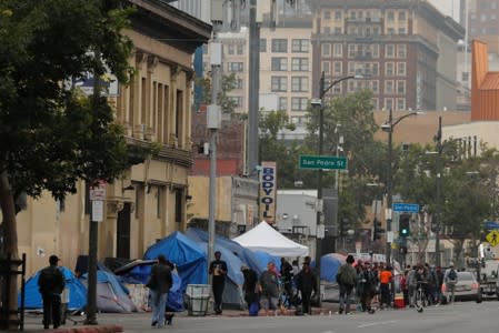 Tents and tarps erected by homeless people are shown along the sidewalks in the skid row area of downtown Los Angeles, California