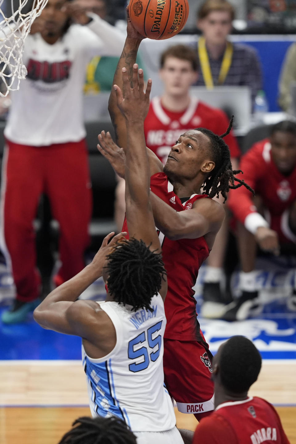 North Carolina State guard DJ Horne (0) shooting a basket against North Carolina forward Harrison Ingram (55) during the second half of an NCAA college basketball game in the championship of the Atlantic Coast Conference tournament, Saturday, March 16, 2024, in Washington. (AP Photo/Susan Walsh)