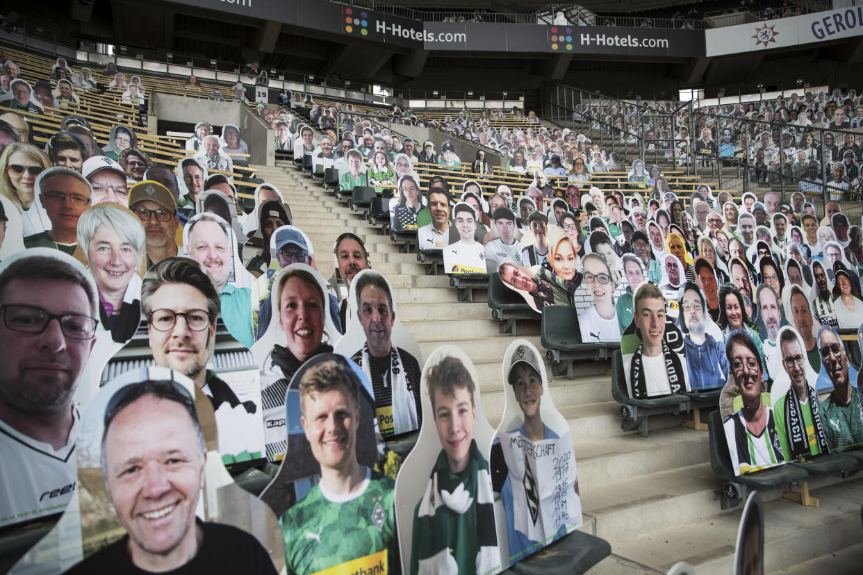 Bundesliga club Borussia Mönchengladbach placed pictures of fans in seats before Saturday's match against Bayern Leverkusen. (Christian Verheyen/Getty Images)