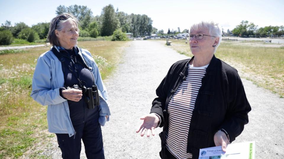 Viveka Ohman, a co-ordinator with White Rock and Surrey Naturalists, left, and Marg Cuthbert, president of Friends of Semiahmoo Bay Society, discuss the importance of Blackie Spit while standing on the only path people are supposed to use on the peninsula.