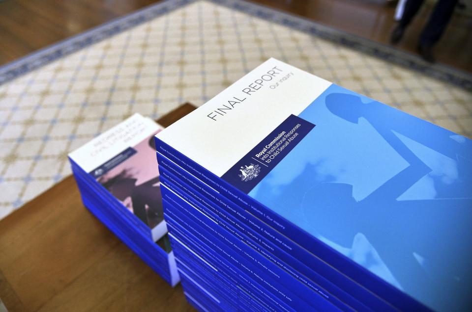 <span class="caption">The final report of the royal commission at Government House in 2017.</span> <span class="attribution"><span class="source">Jeremy Piper/AP</span></span>