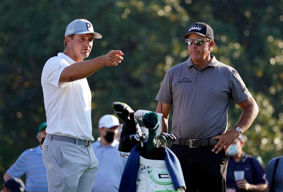 Apr 7, 2021; Augusta, GA, USA; Bryson DeChambeau (left) and Phil Mickelson (right) on the 10th tee during a practice round for The Masters golf tournament at Augusta National Golf Club. Mandatory Credit: Michael Madrid-USA TODAY Sports