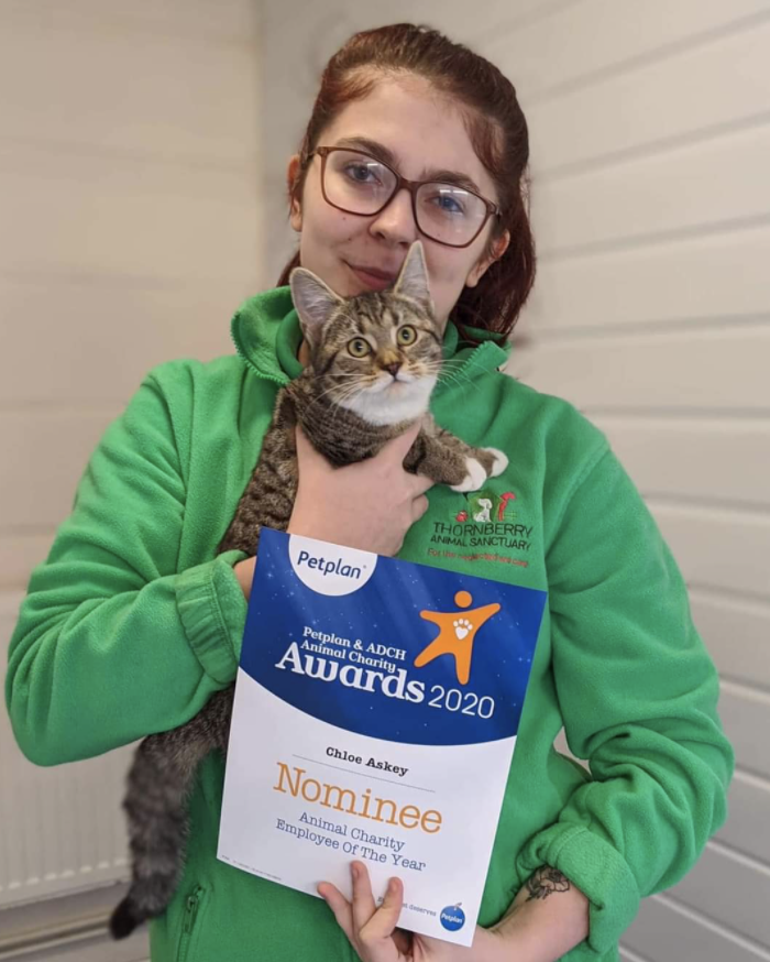 Chloe Askey pictured holding a cat.